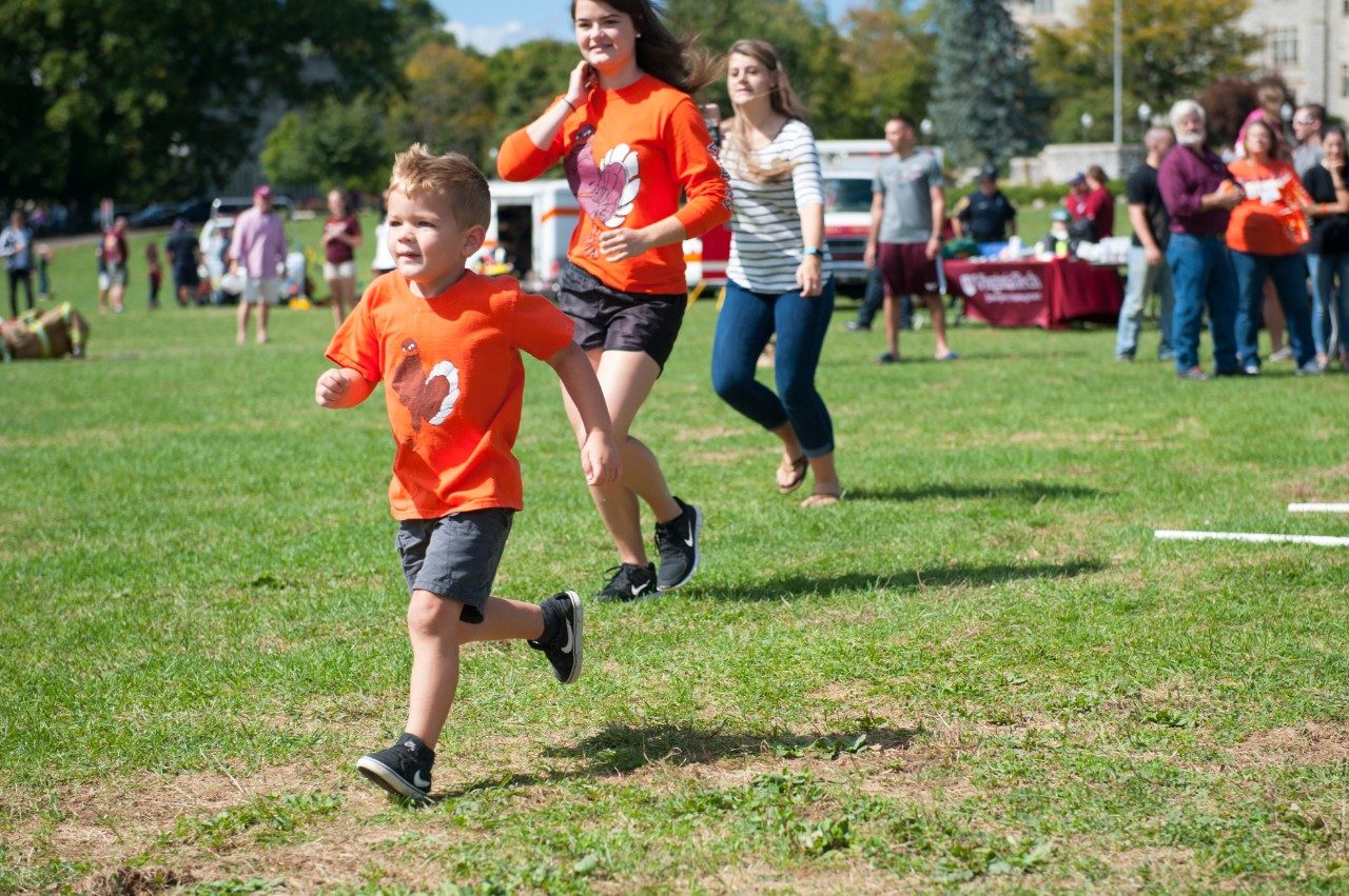 Participants run during Community Day.
