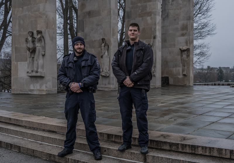 Two security guards by the pylons
