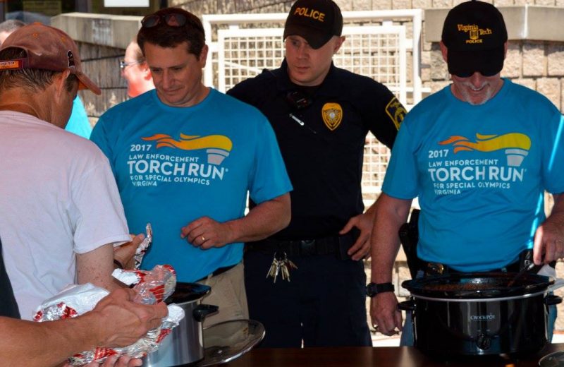 Chief Babb serves chili with other officers