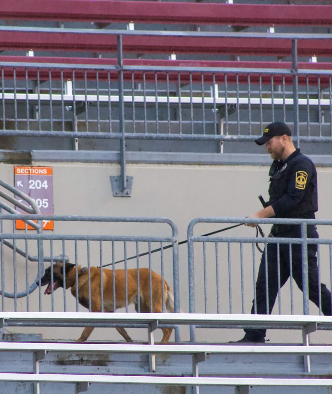 Officer Sumners and K9 Nero search Lane Stadium