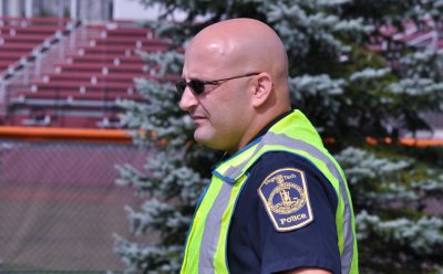 Officer Deriek Crouse in traffic vest