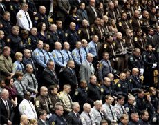 Thousands of officers attend funeral